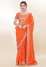 Load image into Gallery viewer, Orange Georgette Bandhani Print Saree